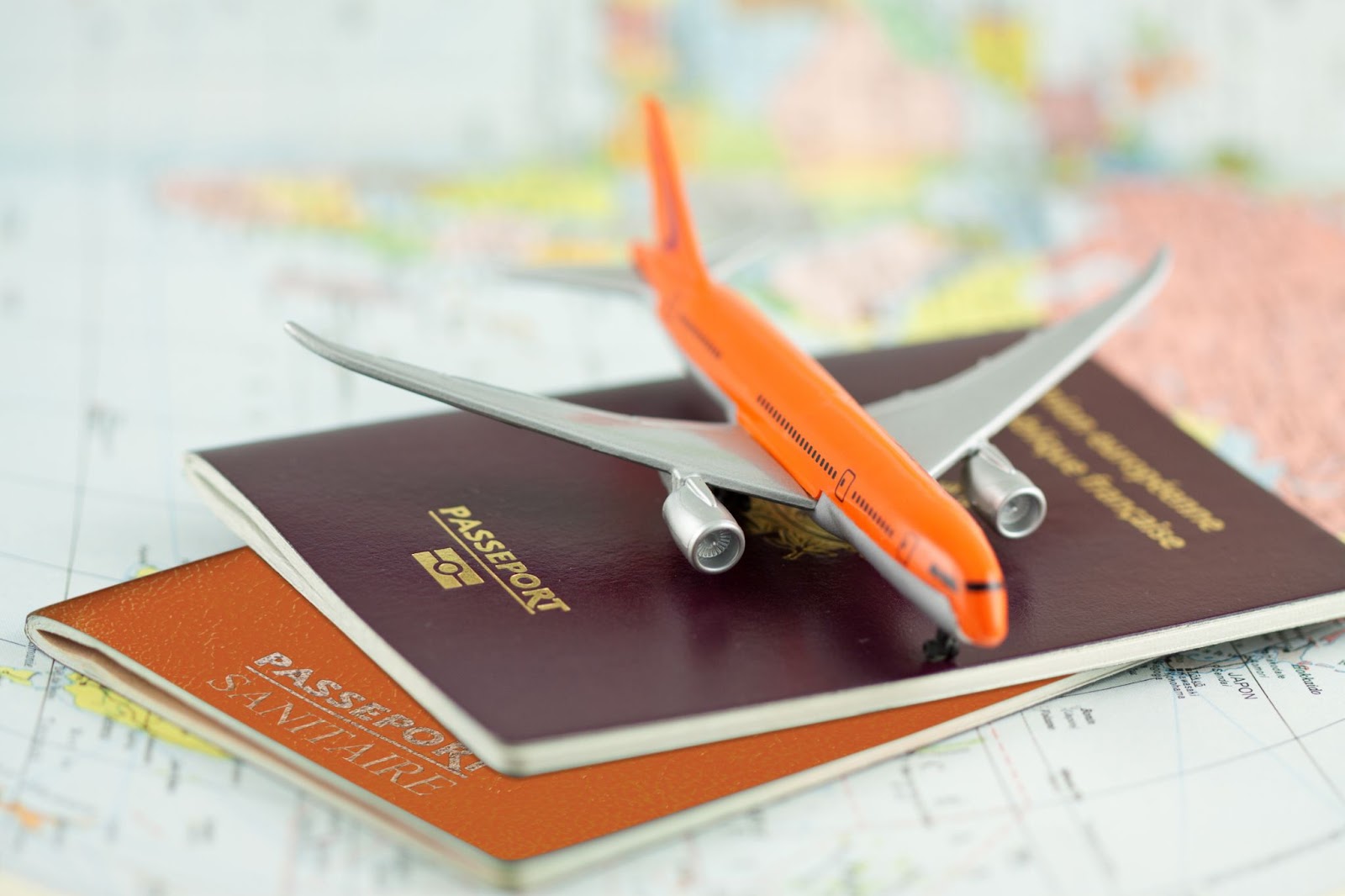 Passport and airplane on a map with EB-2 immigration lawyer, US visa lawyer, EB-2 priority date.